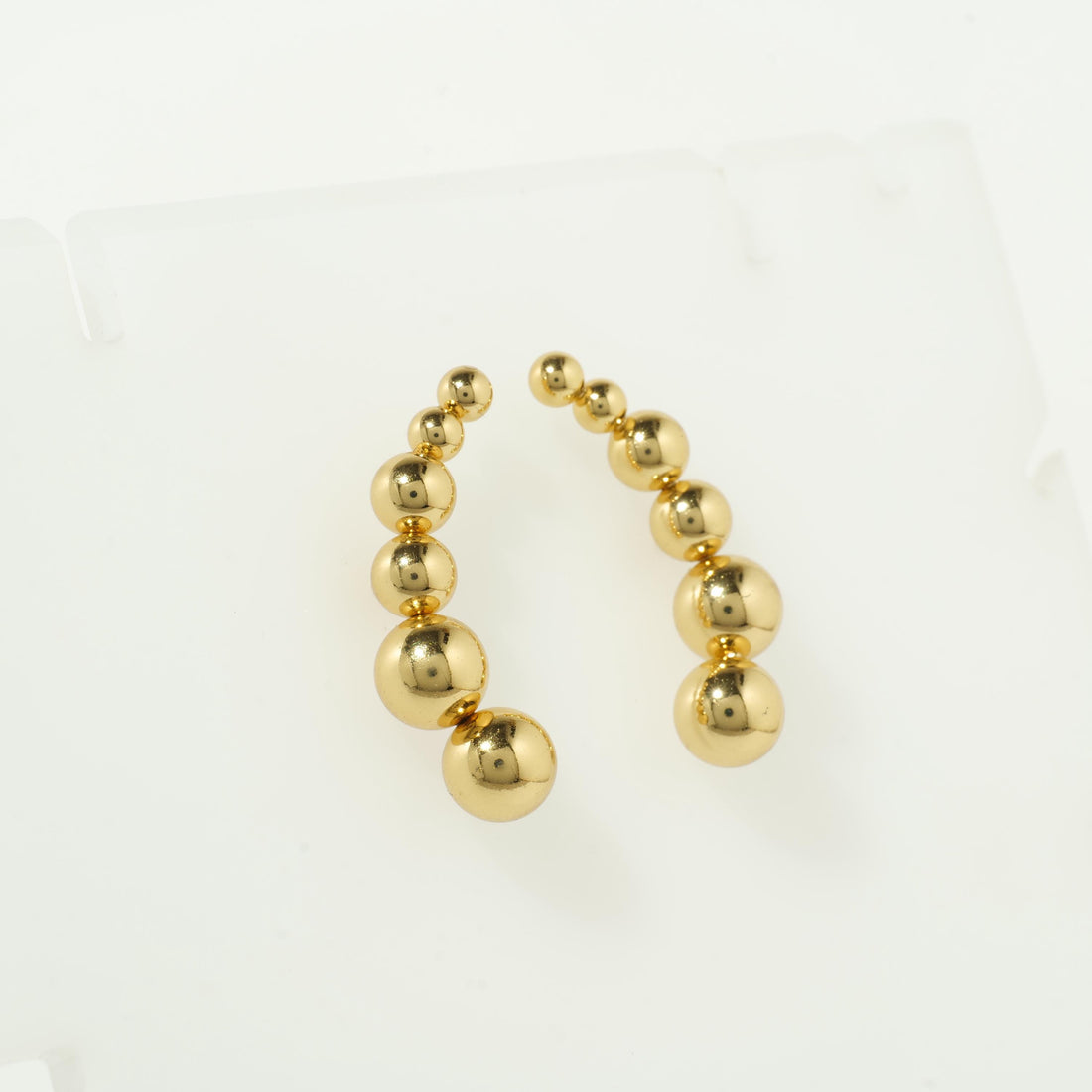 Gold bubble hoop earrings